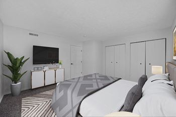 Bedroom with a large bed and a tv on the wall  at Indian Lookout, West Carrollton, Ohio